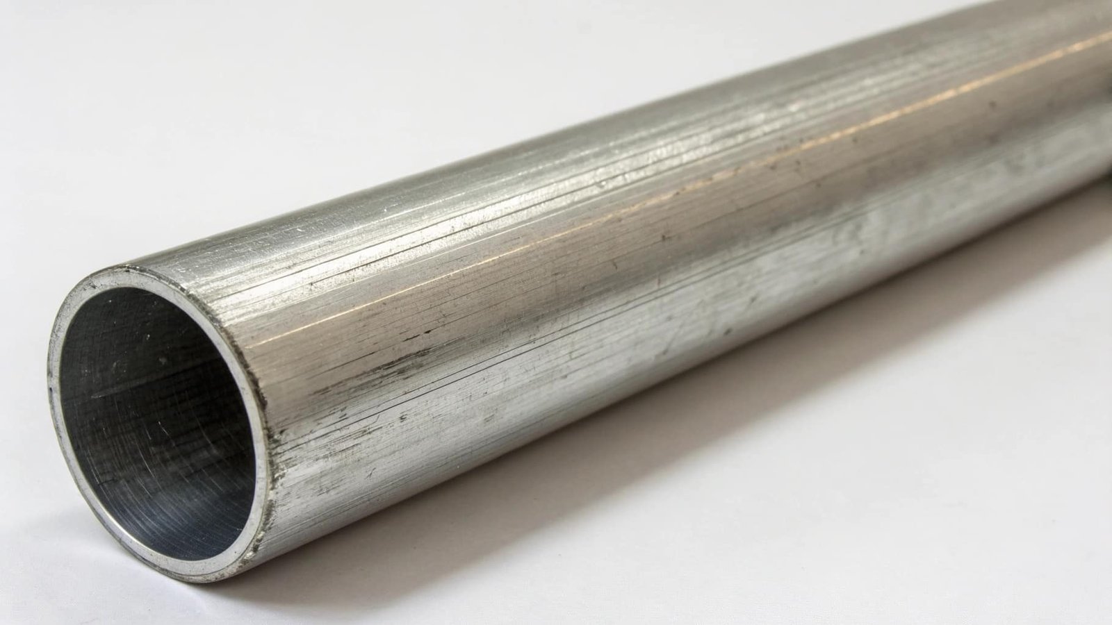 A variety of 6061 extruded aluminum tubes, including round, square, and rectangular profiles, used in structural frames.